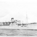 Sailed Liverpool 24 January 1950 Arrived Hong Kong 26 February 1950 The lower portholes indicate the troop deck we occupied. The porthole above our mess table was about half way along from the bow on the port side. The galley was placed mid ships in one of the forward openings of the ships side. The ship has her awnings set. Below the ships boats we paraded each morning and were restricted to the forward part of the ship. The mid ship accommodations and the upper decks were out of bounds. With the top-hamper the Devonshire carried it is not surprising how much she rolled in even the slightest sea.