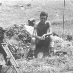 Sitting on a rock, Simms Flash Spotter to left and radio behind and in the customary working gear. It is very different attire to that I wore up on West Down Ranges at Larkhill in the preceding October!