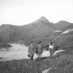 We are on our way to “Able’ OP with High Junk Peak in background. From the left you see Sergeant Mason with tripod, John Flann with Simms on his back, and I think Frank Beames, with a folding chair round his neck and the radio. Our truck is below at the end of the track.